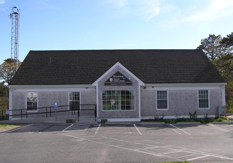 The Monomoy National Wildlife Refuge Visitor Center building and parking lot on a sunny day
