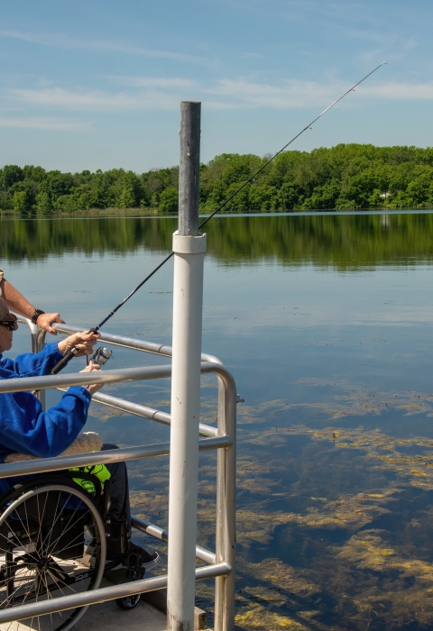 Disabled Veteran Fishing from an accessible boat launch
