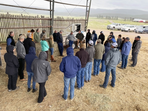 Blackfoot Valley partners meeting on a ranch, approx 20 people standing in ranch environment