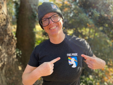 Holly Richards poses for a photo outside while wearing a shirt that says FWS Pride 