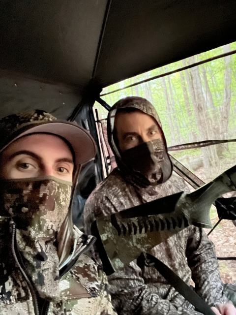 Mentor and Mentee wearing camouflage sitting in a turkey blind